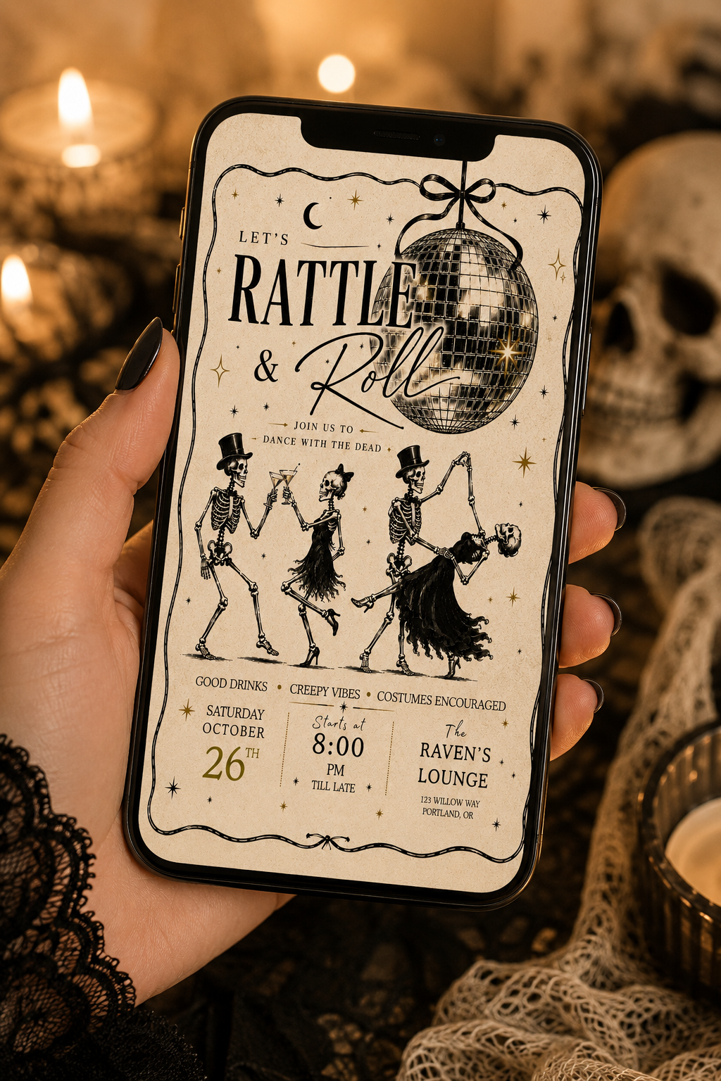 A hand holds a smartphone displaying a gothic-themed event invitation design with skeleton dancers, a disco ball, and vintage text. The background is a warm, dimly lit setting with candles, lace, and a skull.