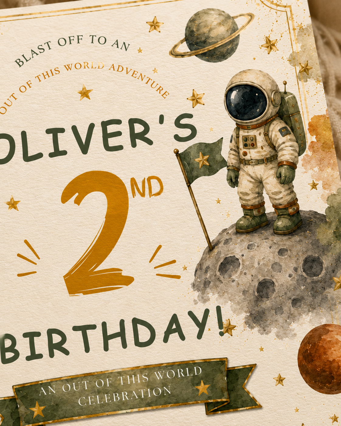 A close-up of a children's birthday invitation or print featuring an astronaut standing on a moon, with planets, stars, and large text reading 'Oliver's 2nd Birthday!'.