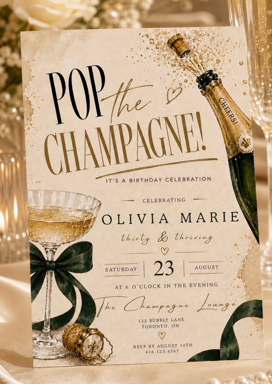 Champagne party invitation with gold bottle emerald ribbon and sparkling coupe glass