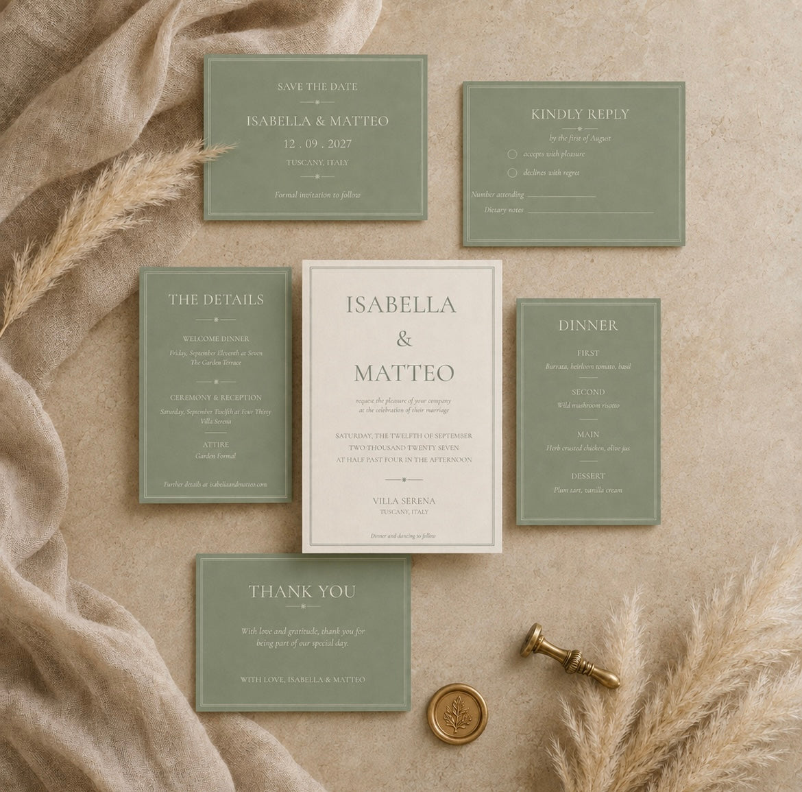 A coordinated wedding invitation suite arranged on a beige fabric surface with dried grasses and a gold seal. The set includes a central off-white invitation card, five sage green detail cards, and a matching save-the-date and kindly reply card.