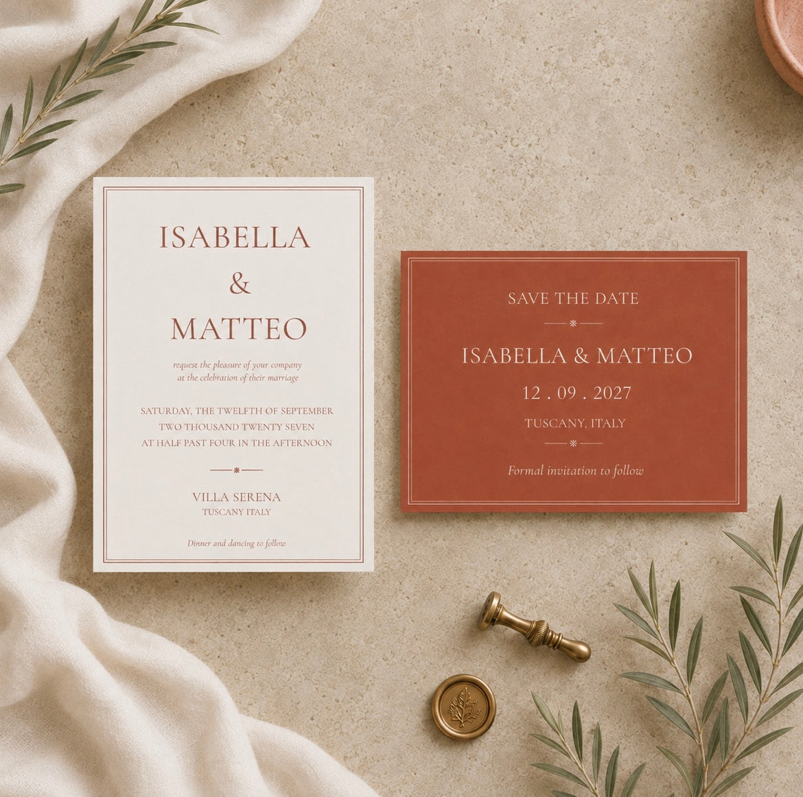A styled flat-lay of a wedding invitation suite on a textured beige surface. The set includes a cream invitation card with elegant brown typography and a terracotta-colored 'Save the Date' card.